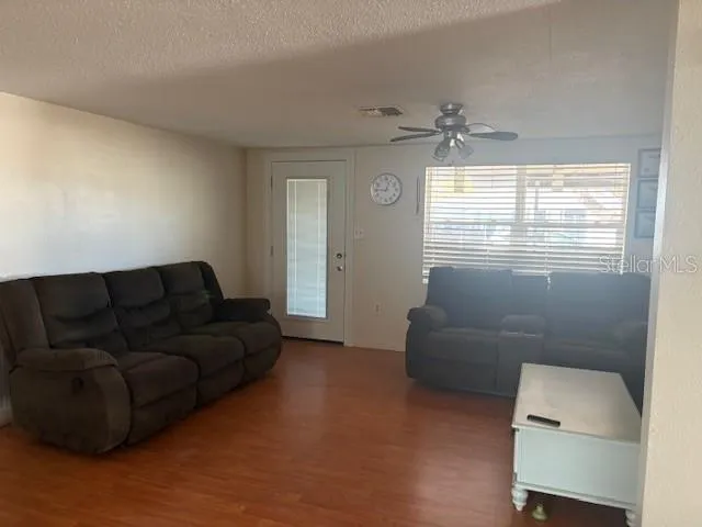 a living room with furniture and a window