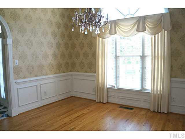7624 Wilderness Road Raleigh, NC 27613 - Photo 4 of 25 Elegance & more in this oversized formal dining room and large window & 1/2 round to let in the natural light Dining Room