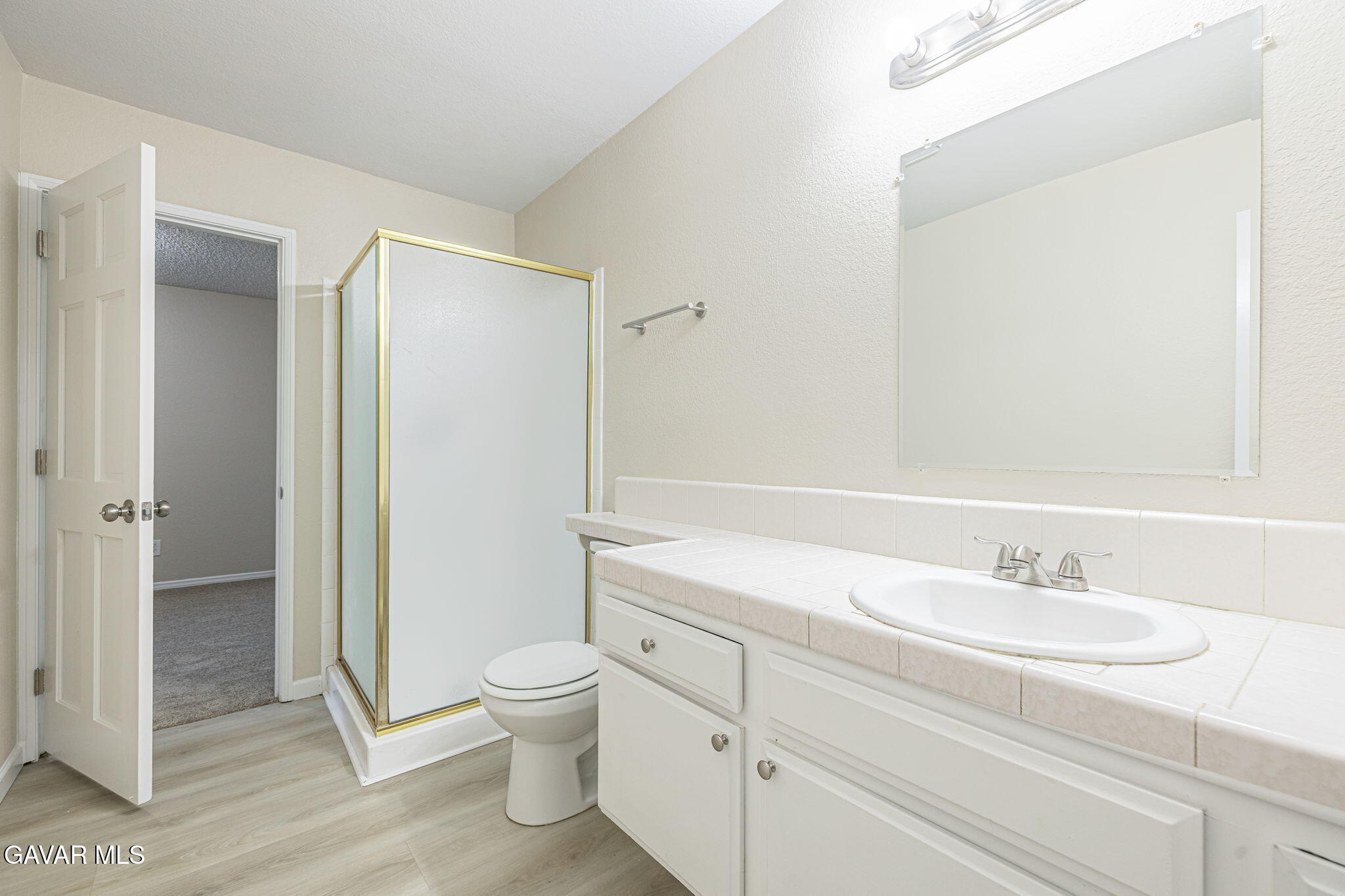 1201 Camran Avenue Lancaster, CA 93535 - Photo 18 of 49 a bathroom with a sink a toilet and shower