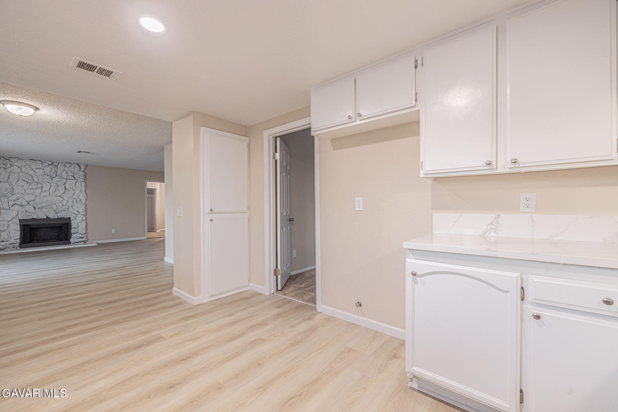 1201 Camran Avenue Lancaster, CA 93535 - Photo 2 of 49 a view of an empty room with wooden floor and a cabinet