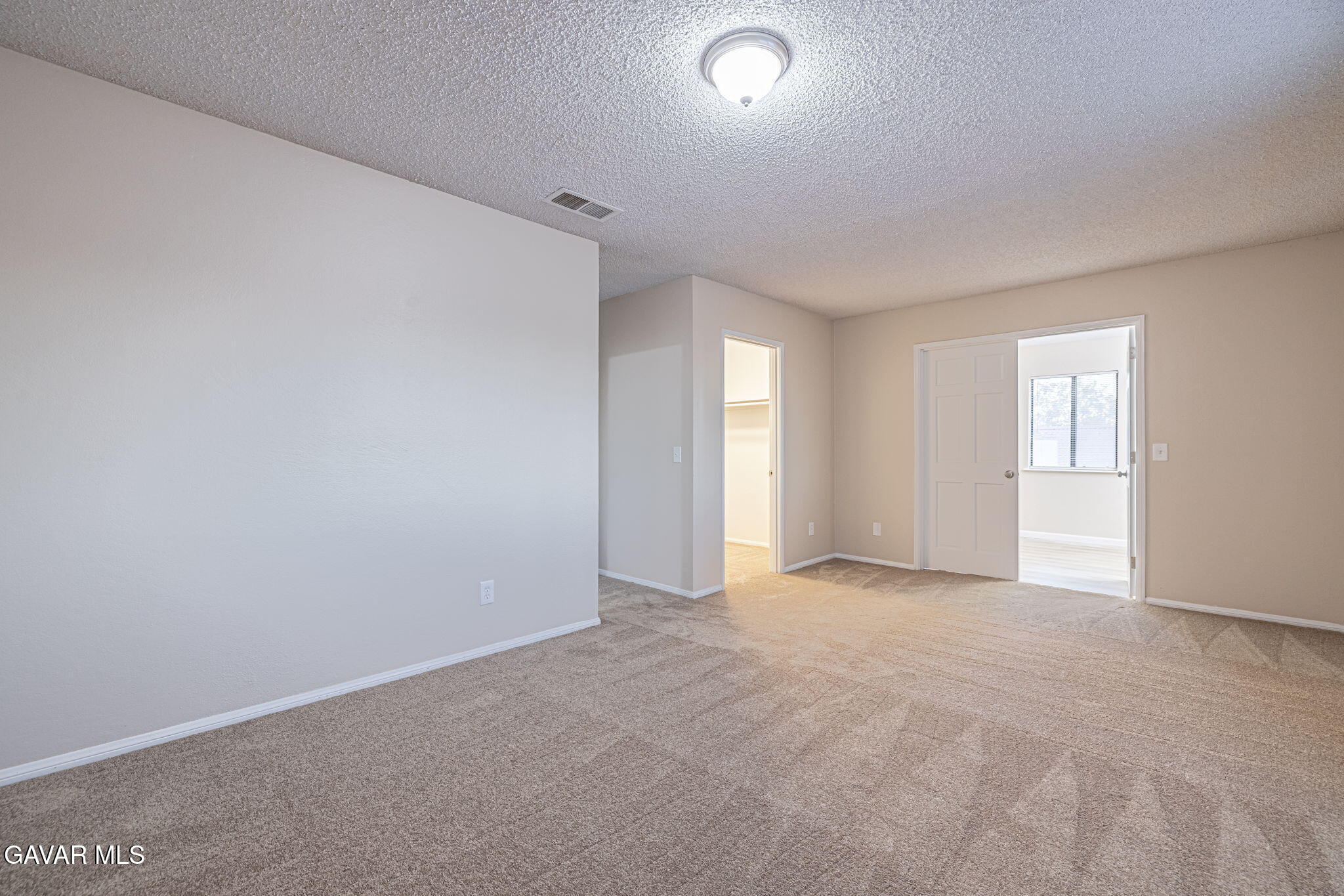 1201 Camran Avenue Lancaster, CA 93535 - Photo 7 of 49 an empty room with windows and closet