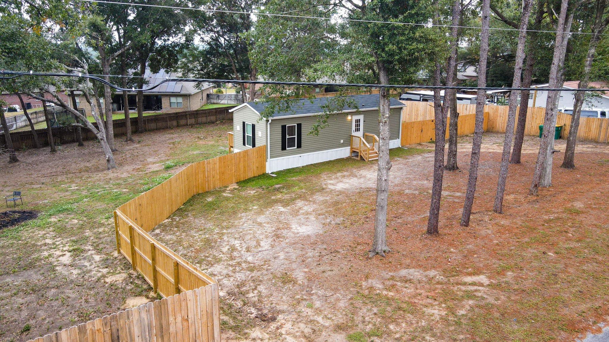 a view of a backyard with sitting area