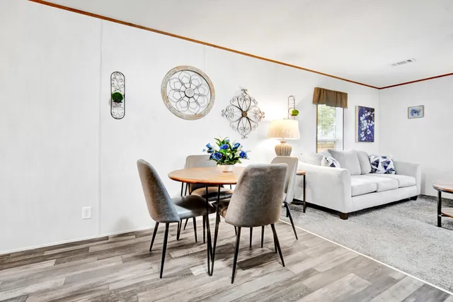 a dining room with furniture and a table