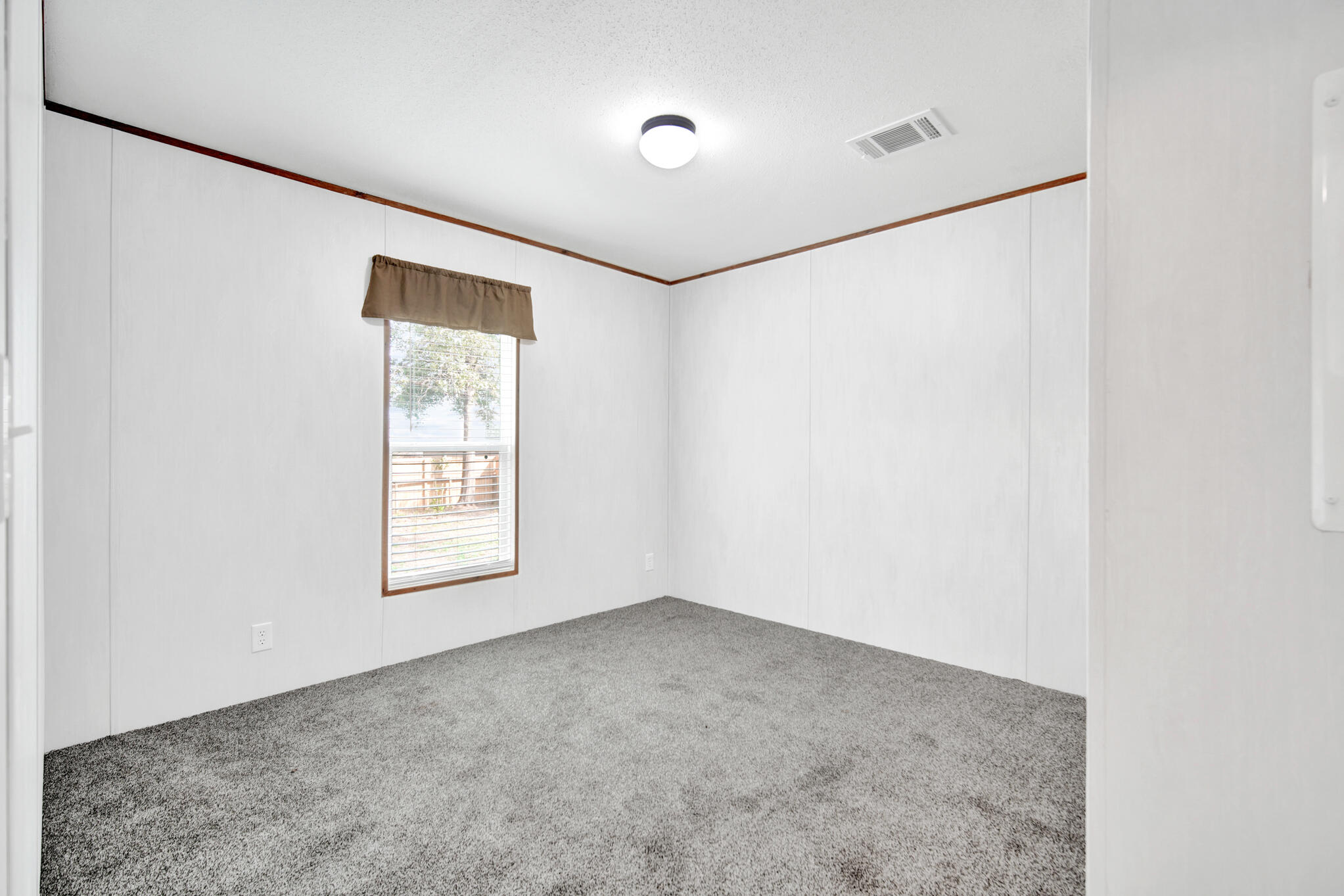 2303 Lewis Street Crestview, FL 32536 - Photo 23 of 32 a view of an empty room with a window