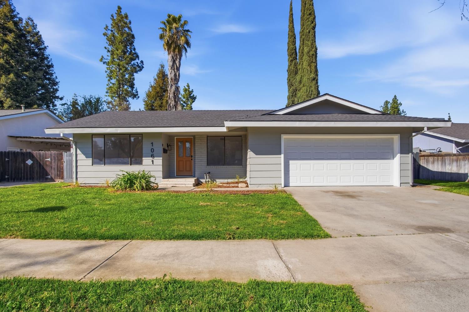 1061 Northwood Drive Merced, CA 95348 - Photo 1 of 1 a front view of a house with a garden and plants