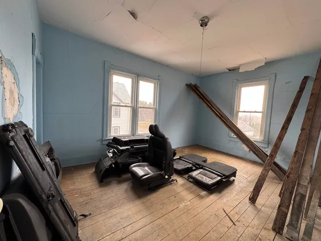 a room with gym equipment and a window