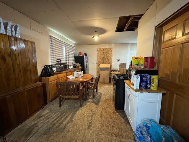a room with furniture a window and wooden floor