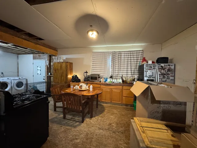 a view of a workspace with furniture