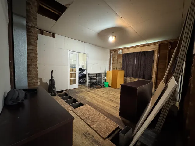 a kitchen with sink refrigerator and window