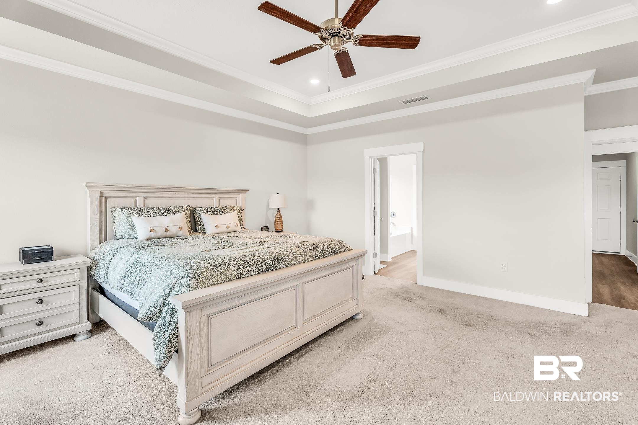 1720 Partridge Street Foley, AL 36535 - Photo 16 of 32 Bedroom with ceiling fan, a raised ceiling, ornamental molding, and light colored carpet