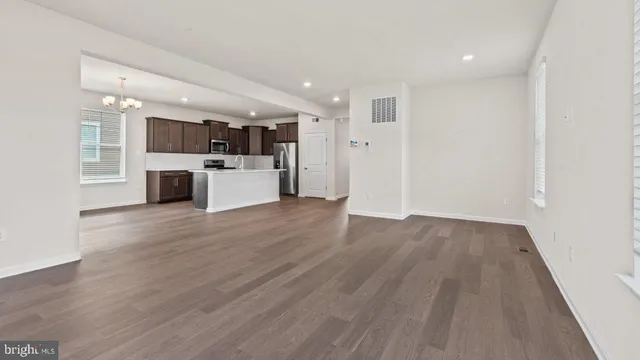 a view of kitchen with wooden floor