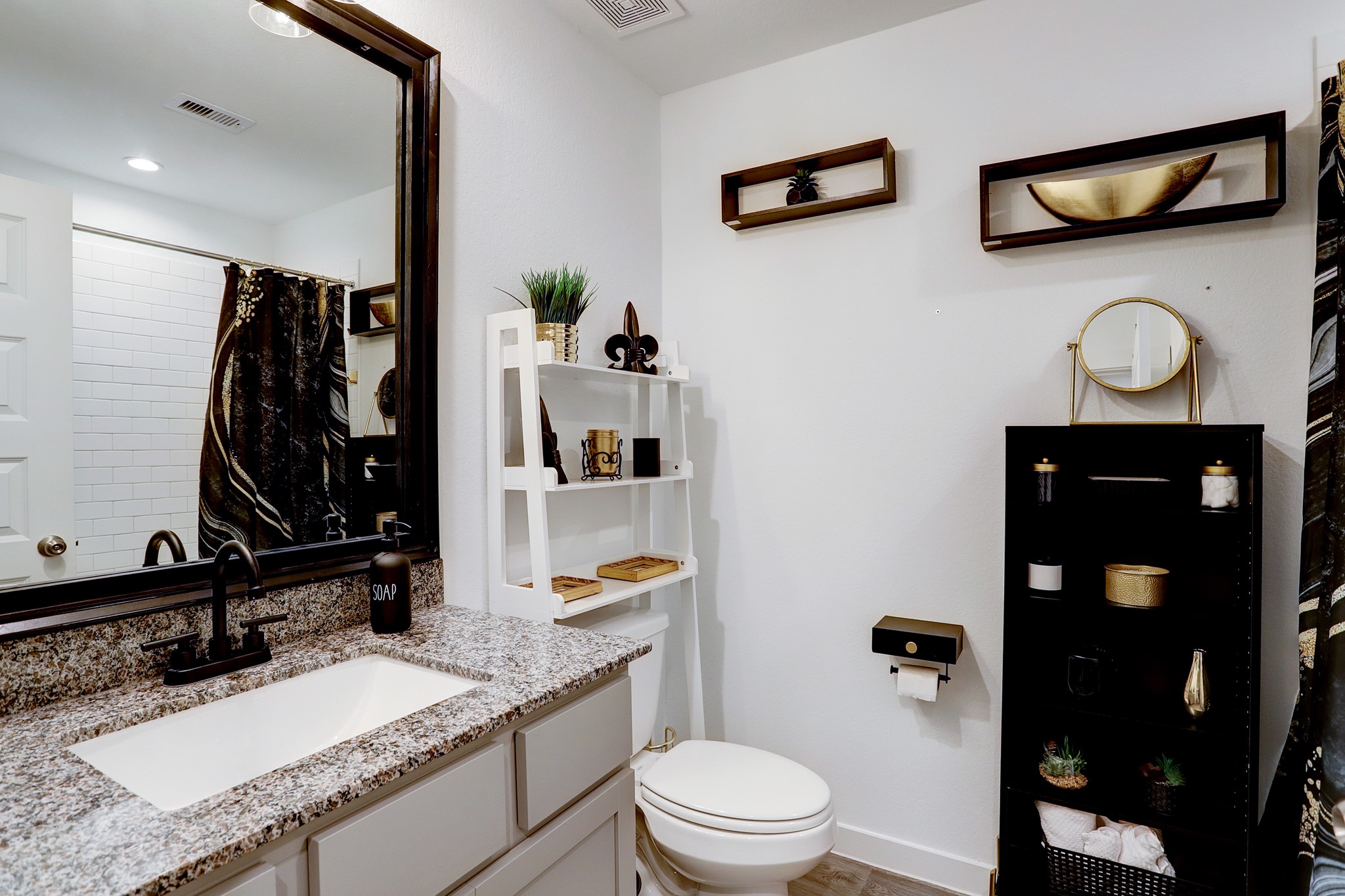 3838 Beltingham Bend Way Fulshear, TX 77441 - Photo 13 of 22 a bathroom with a granite countertop sink a toilet and a mirror