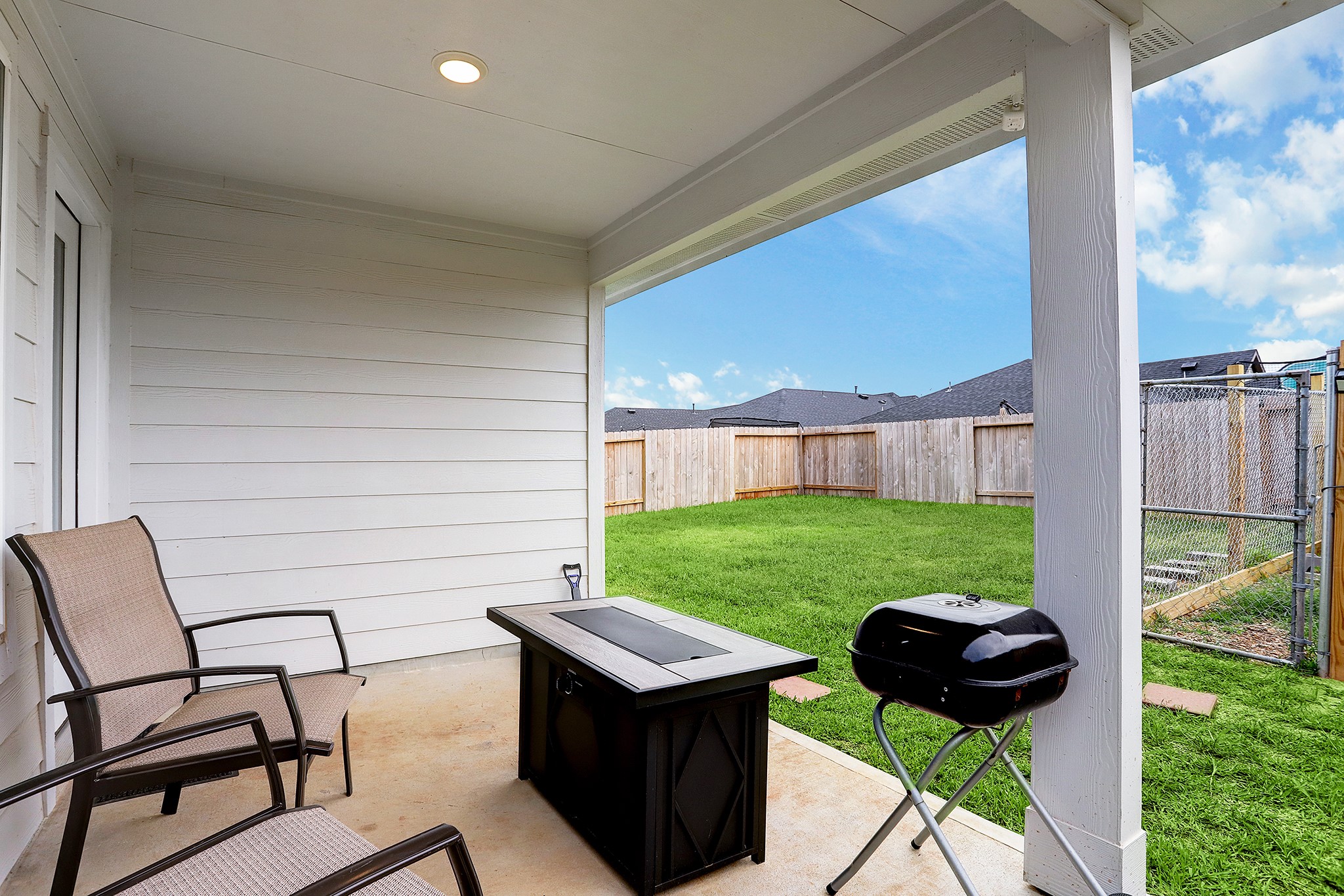 3838 Beltingham Bend Way Fulshear, TX 77441 - Photo 16 of 22 a view of a backyard with furniture