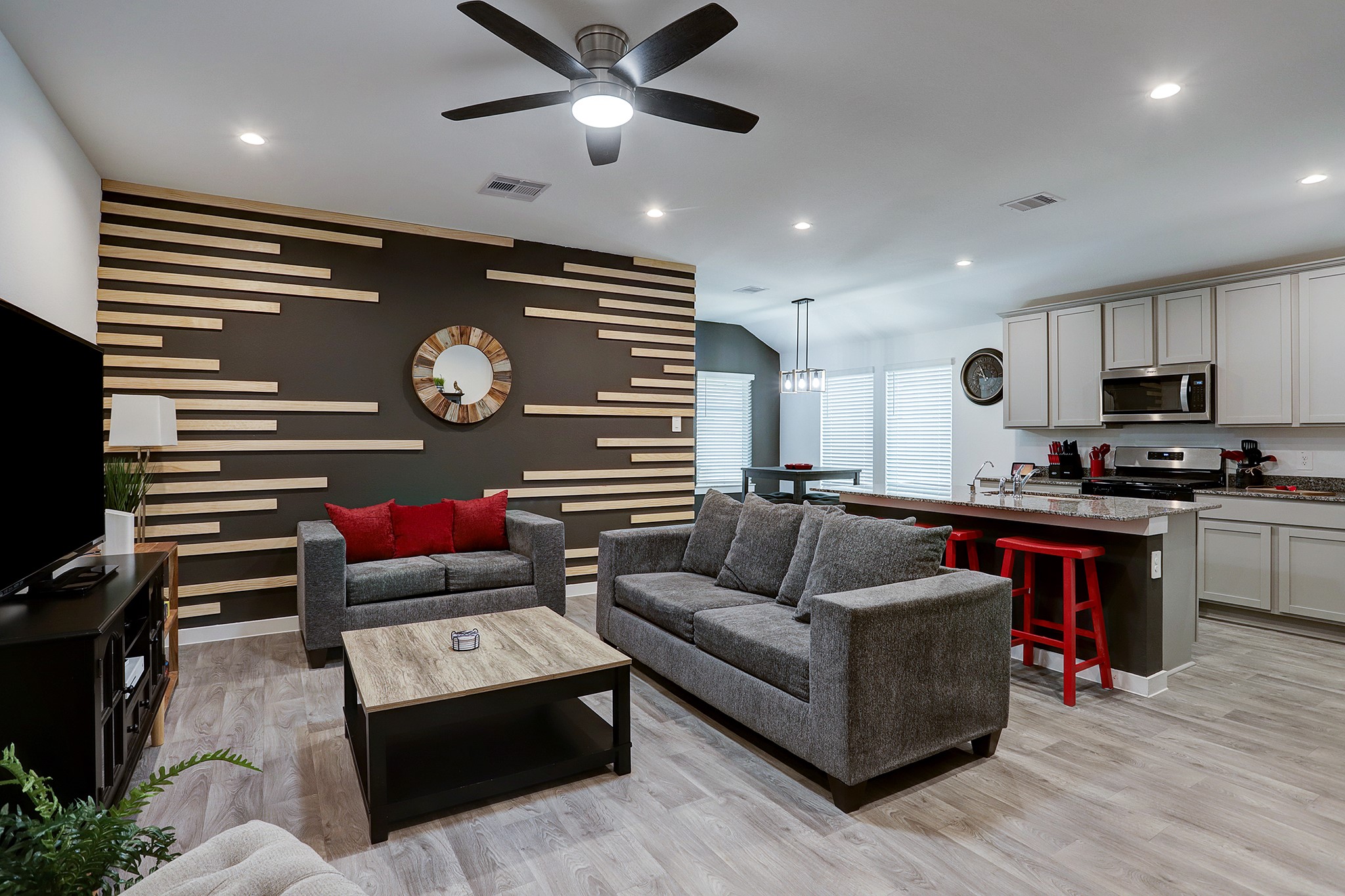 3838 Beltingham Bend Way Fulshear, TX 77441 - Photo 2 of 22 a living room with furniture and a wooden floor