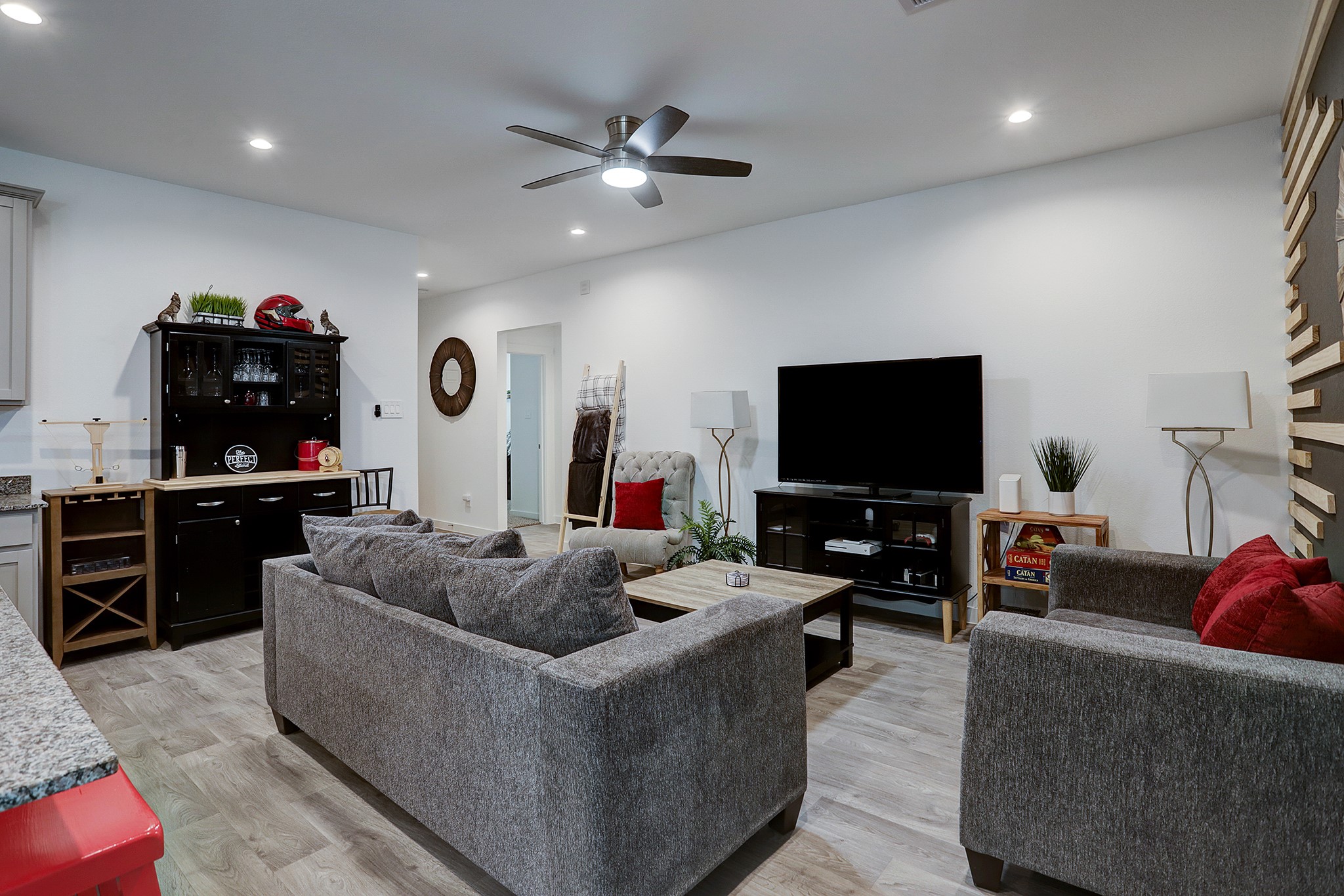 3838 Beltingham Bend Way Fulshear, TX 77441 - Photo 4 of 22 a living room with furniture and a flat screen tv
