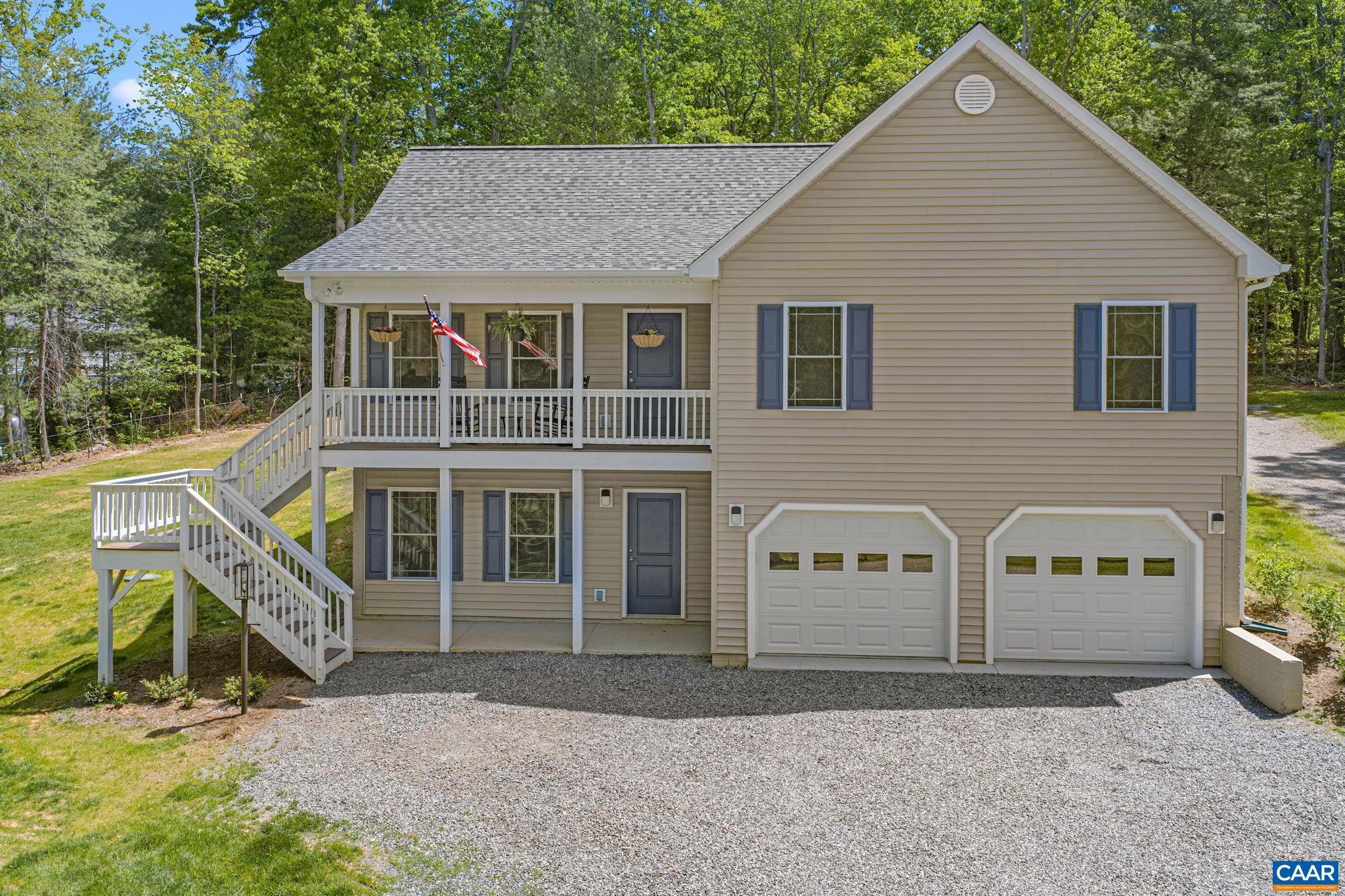 230 Fox Hollow Road Ruckersville, VA 22968 - Photo 2 of 42 a front view of a house with a yard