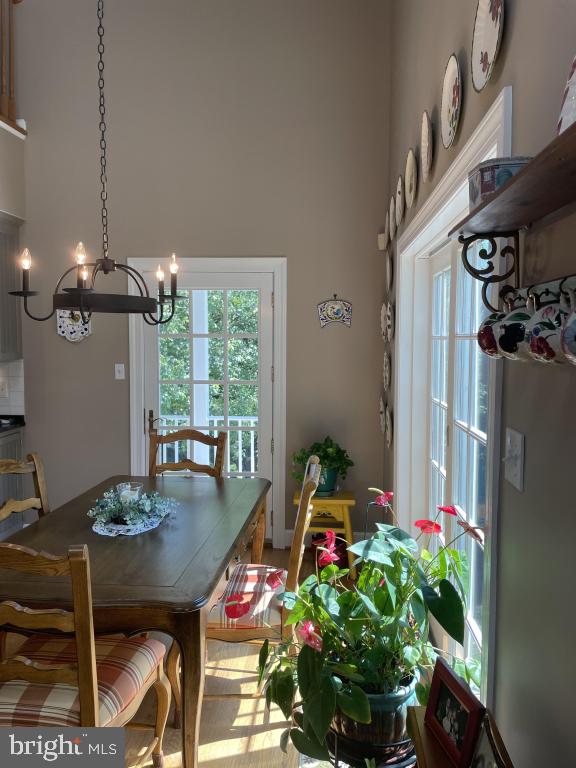 5597 Sedwick Court Frederick, MD 21702 - Photo 23 of 66 a view of a dining room with furniture window and wooden floor