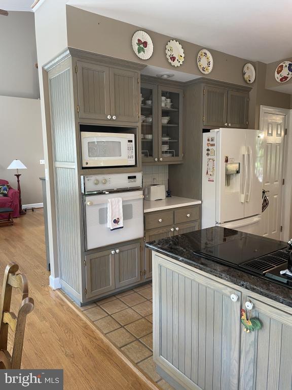 5597 Sedwick Court Frederick, MD 21702 - Photo 27 of 66 a kitchen with granite countertop a sink and a stove top oven