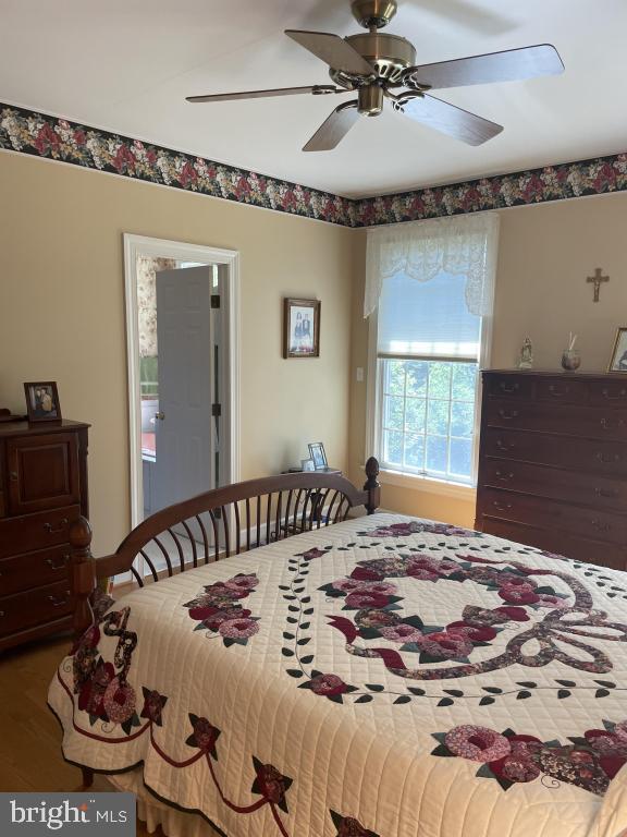 5597 Sedwick Court Frederick, MD 21702 - Photo 35 of 66 a bedroom with a bed and a dresser