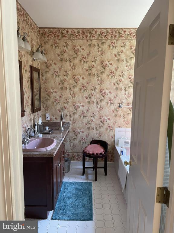 5597 Sedwick Court Frederick, MD 21702 - Photo 38 of 66 a bathroom with a sink and a mirror