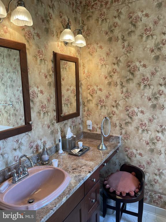 5597 Sedwick Court Frederick, MD 21702 - Photo 41 of 66 a bathroom with a sink and a mirror