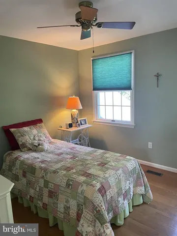 a living room with furniture and a chair