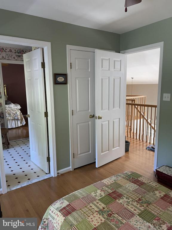 5597 Sedwick Court Frederick, MD 21702 - Photo 45 of 66 a bedroom with a bed and a mirror