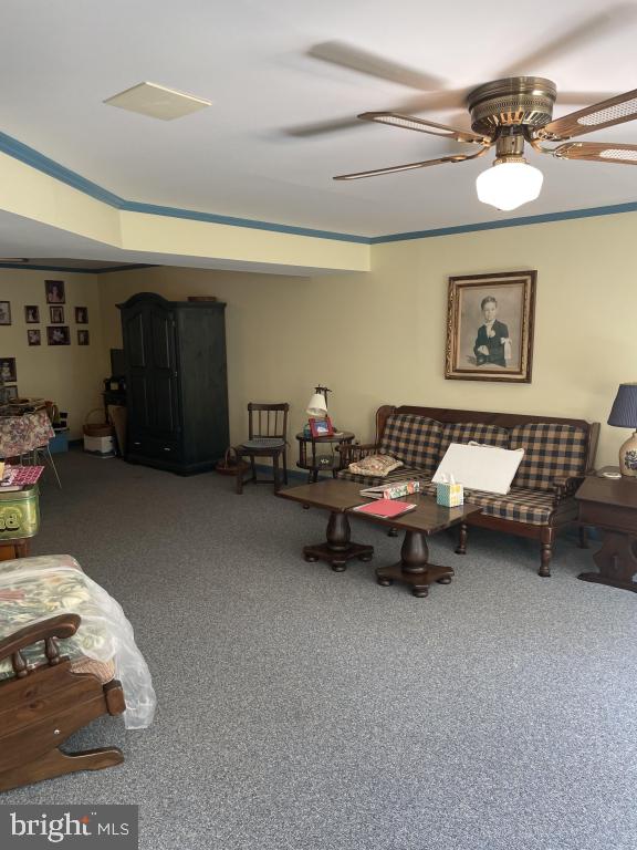 5597 Sedwick Court Frederick, MD 21702 - Photo 55 of 66 a living room with furniture and a chair