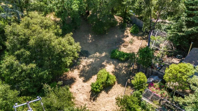 a backyard of a house with a yard with outdoor seating