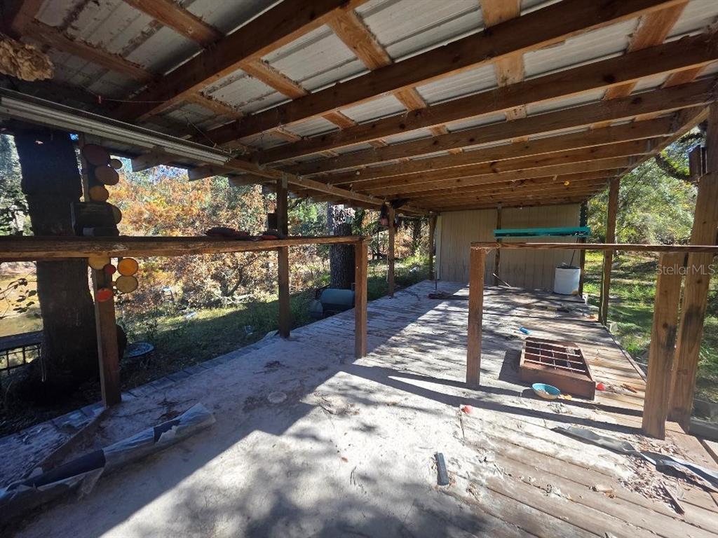 33039 Round Table Road Dade City, FL 33523 - Photo 6 of 11 a view of a porch