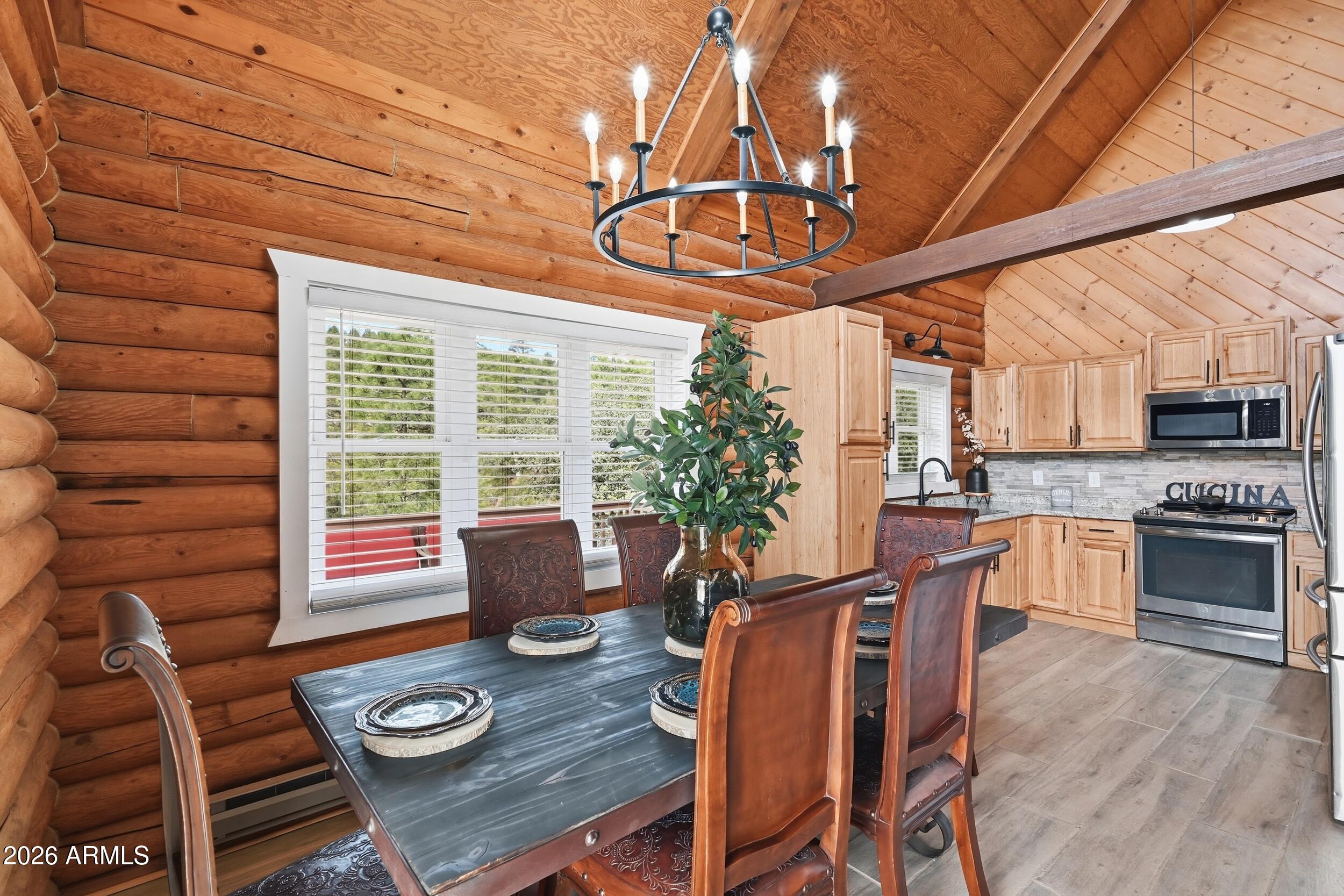 228 East Belluzzi Boulevard Payson, AZ 85541 - Photo 16 of 53 a view of a dining room with furniture window and wooden floor
