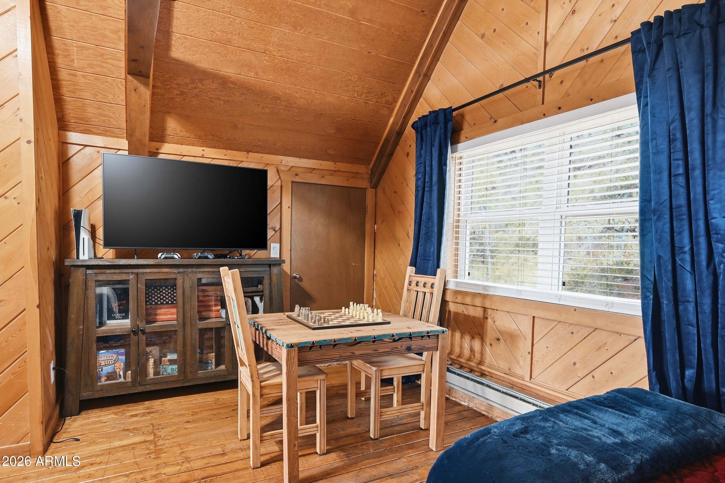 228 East Belluzzi Boulevard Payson, AZ 85541 - Photo 28 of 53 a view of a dining room with furniture and wooden floor