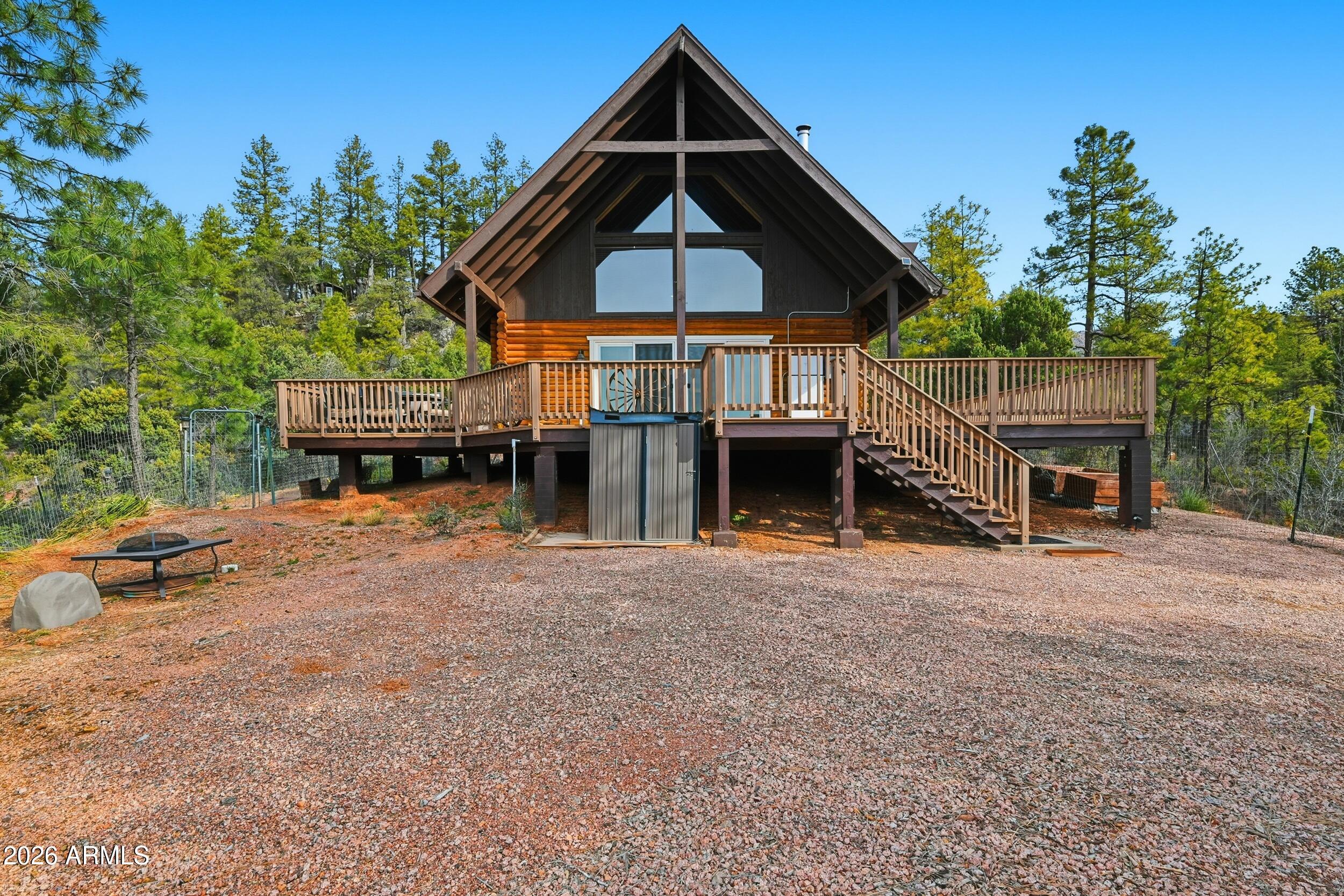 228 East Belluzzi Boulevard Payson, AZ 85541 - Photo 6 of 53 a front view of a house with a yard