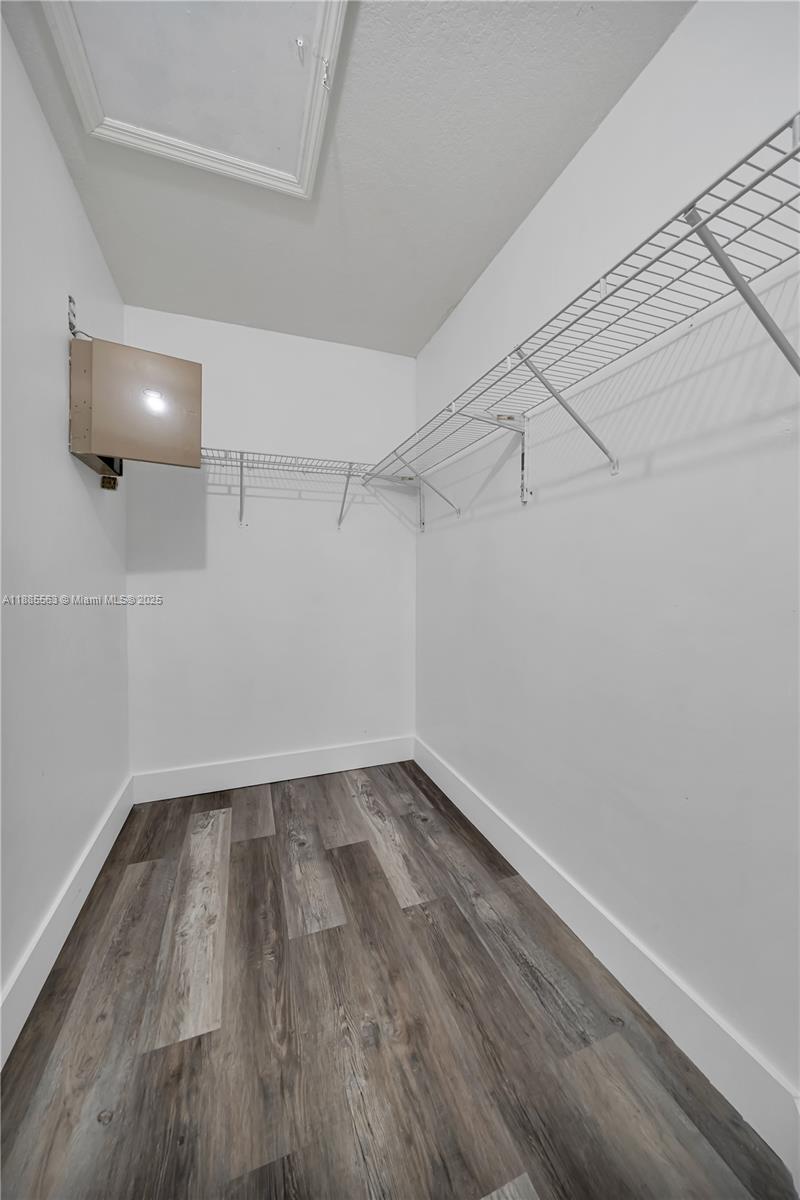 1261 Southeast 27th Street, Unit 203 Homestead, FL 33035 - Photo 14 of 18 a view of a room with wooden floor