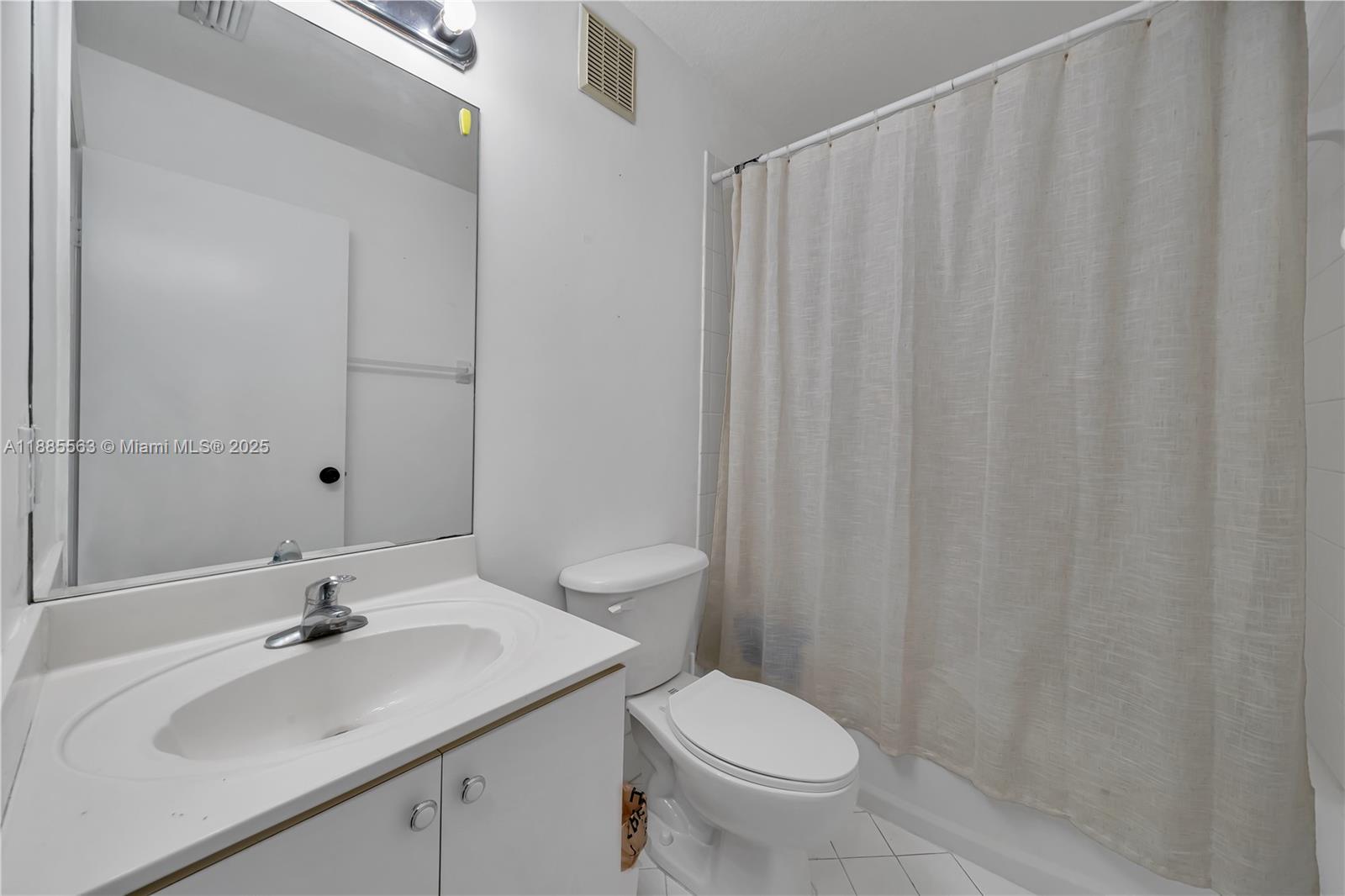 1261 Southeast 27th Street, Unit 203 Homestead, FL 33035 - Photo 17 of 18 a bathroom with a sink and a toilet