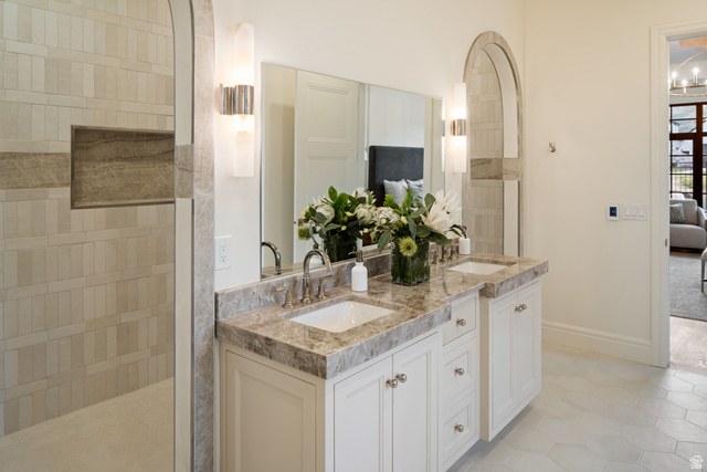 423 Eldorado Drive Mapleton, UT 84664 - Photo 21 of 40 Full bath featuring ensuite bath, double vanity, light tile patterned floors, and a walk in shower
