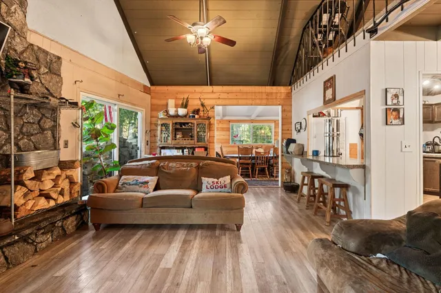 a living room with furniture fireplace and a flat screen tv