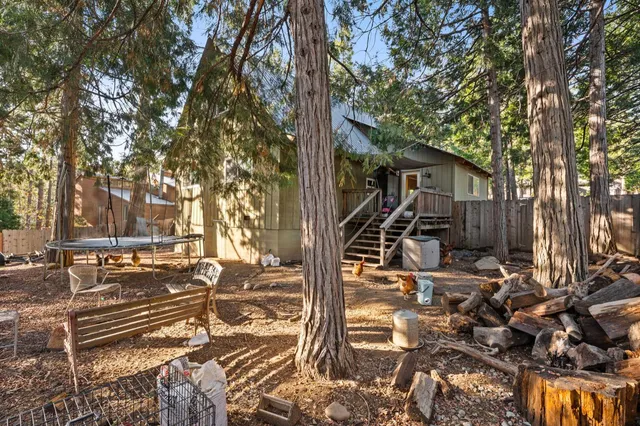 a view of a house with a tree