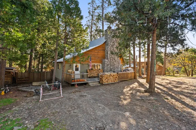 a view of a house with a yard and sitting area