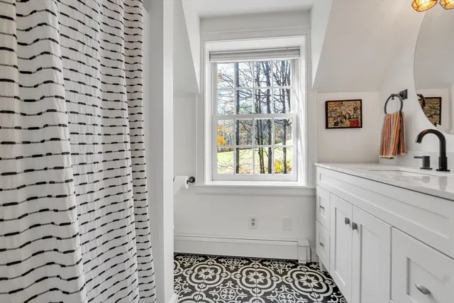 a lobby with furniture and a potted plant