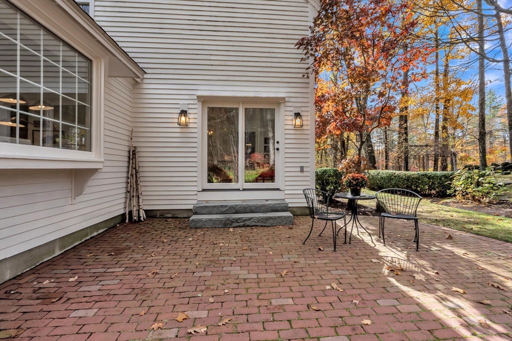 4 Black Hill Road Paxton, MA 01612 - Photo 30 of 42 a view of a patio with a table and chairs and potted plants