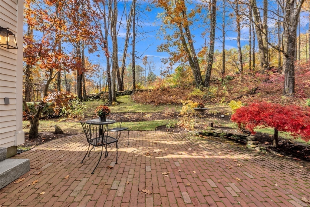 4 Black Hill Road Paxton, MA 01612 - Photo 31 of 42 a backyard of a house with table and chairs