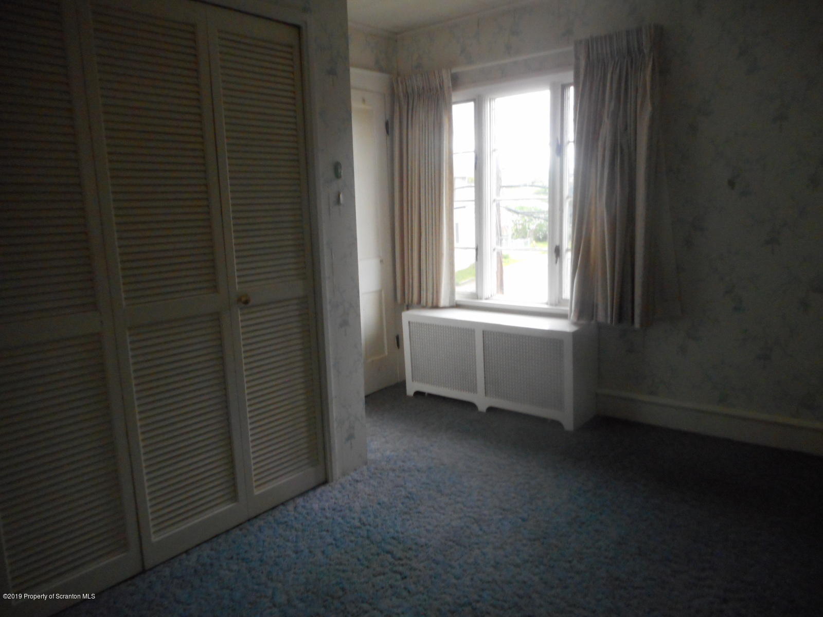 232 Oak Street Old Forge, PA 18518 - Photo 11 of 19 a view of a room that has a window in it