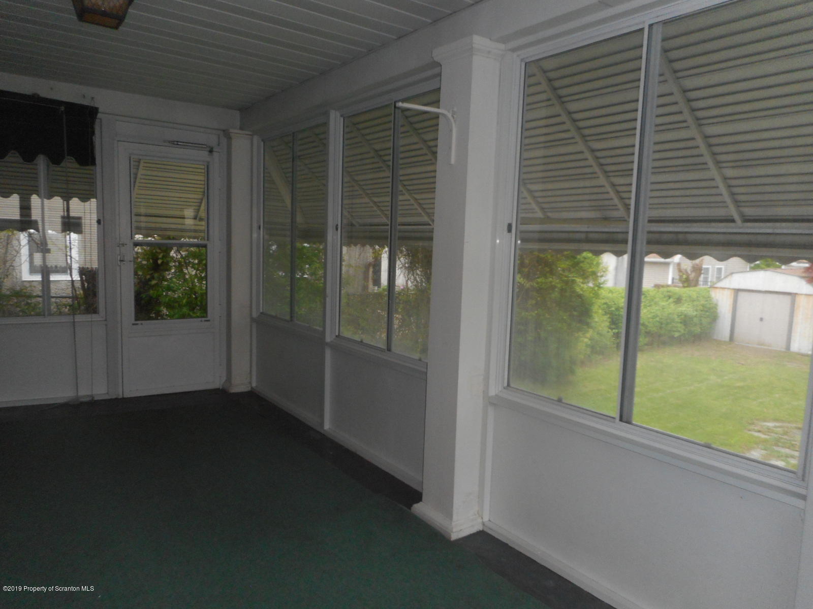 232 Oak Street Old Forge, PA 18518 - Photo 15 of 19 a view of an empty room with a window