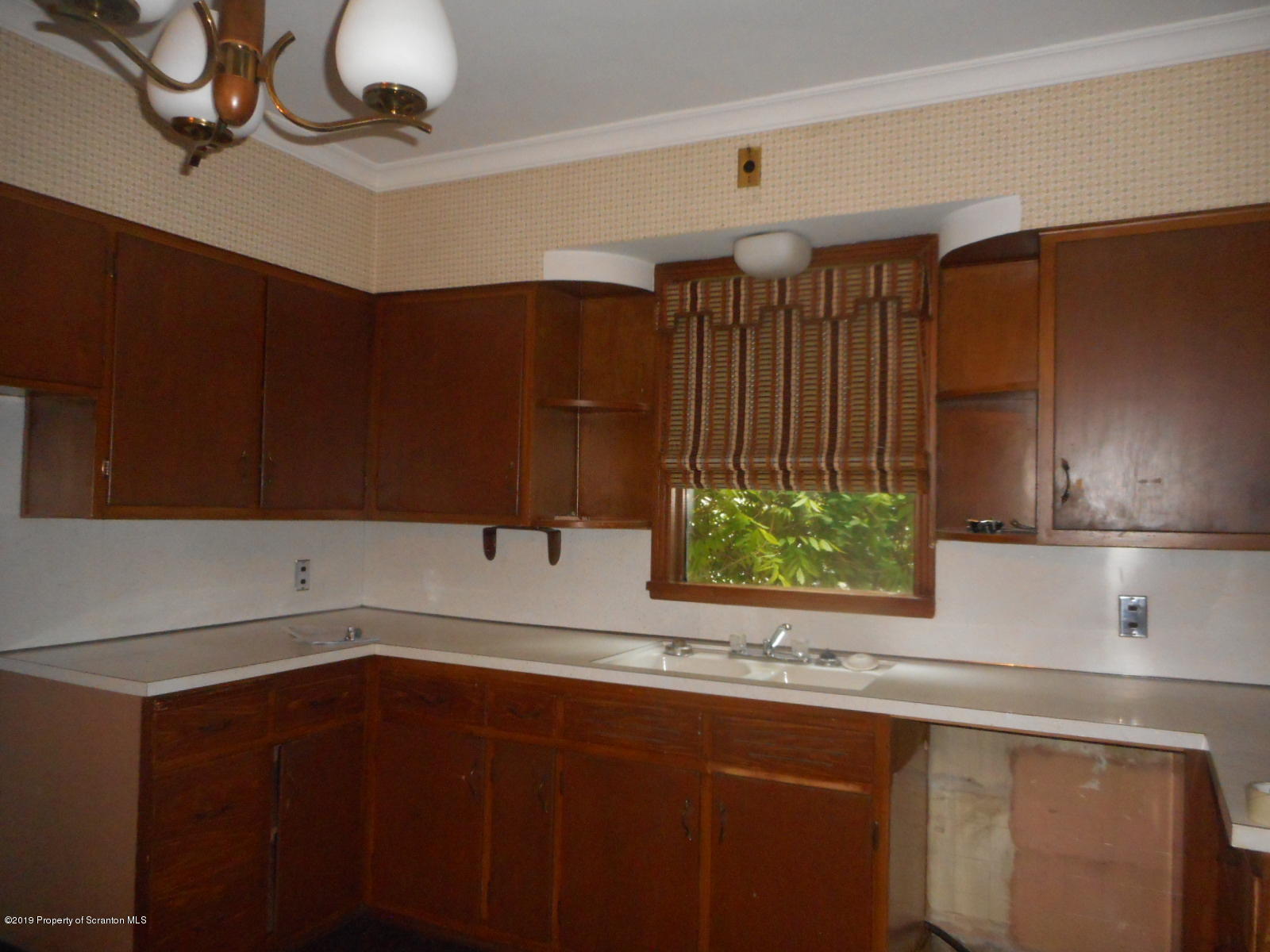 232 Oak Street Old Forge, PA 18518 - Photo 3 of 19 a kitchen with a sink and cabinets