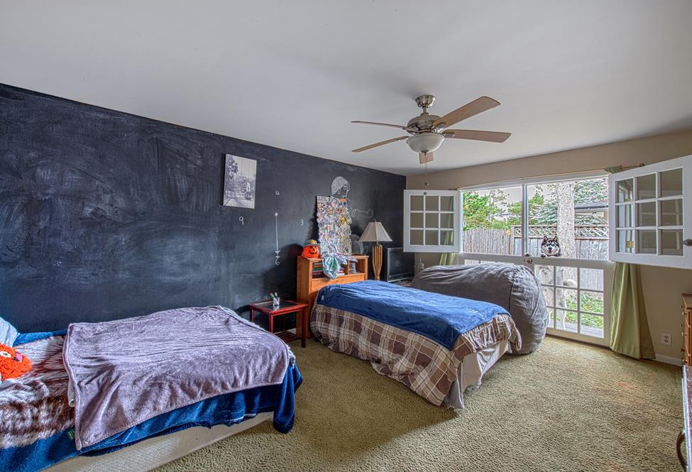 3041 Bird Rock Road Pebble Beach, CA 93953 - Photo 11 of 18 a spacious bedroom with a bed and a large window
