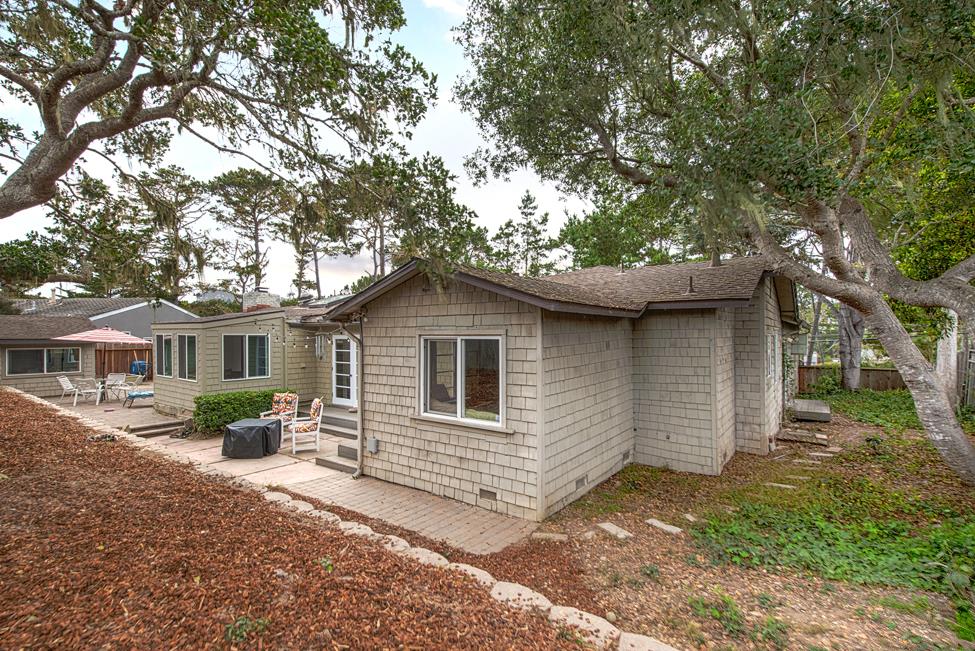 3041 Bird Rock Road Pebble Beach, CA 93953 - Photo 13 of 18 a front view of a house with yard