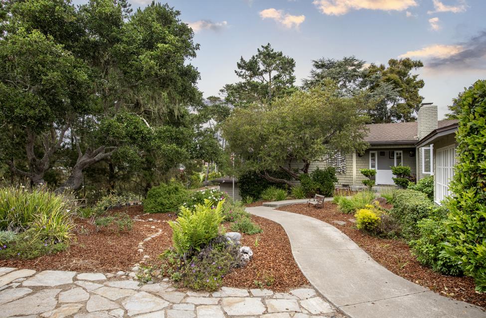 3041 Bird Rock Road Pebble Beach, CA 93953 - Photo 3 of 18 a view of a patio with table and chairs and potted plants