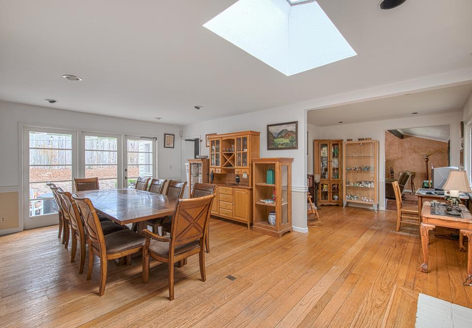 3041 Bird Rock Road Pebble Beach, CA 93953 - Photo 5 of 18 a dining room with furniture and wooden floor