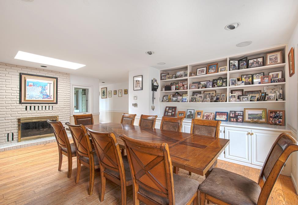 3041 Bird Rock Road Pebble Beach, CA 93953 - Photo 6 of 18 a view of a dining room with furniture and wooden floor